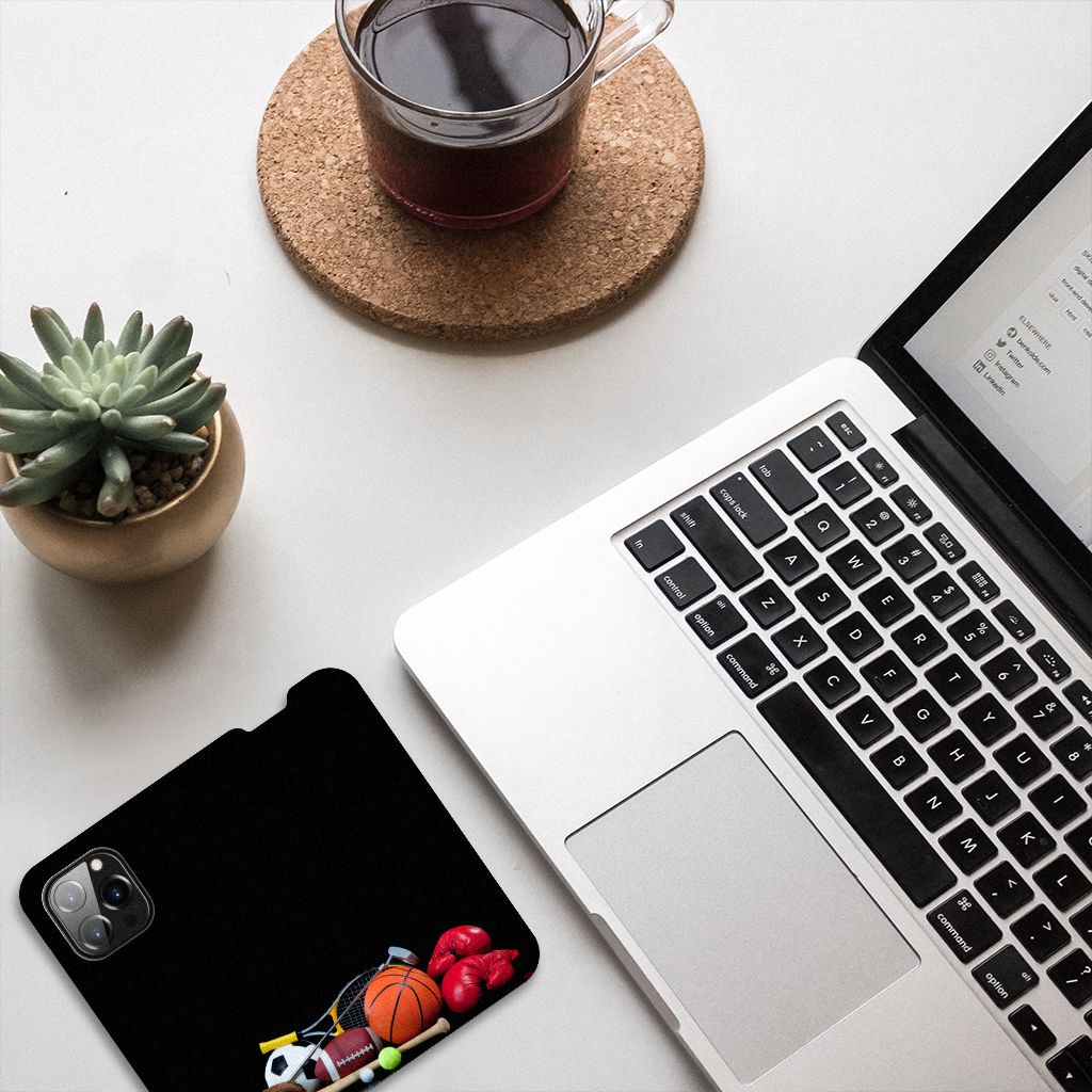 iPhone 14 Pro Hippe Standcase Sports design with sports equipment on a desk next to a laptop and coffee.
