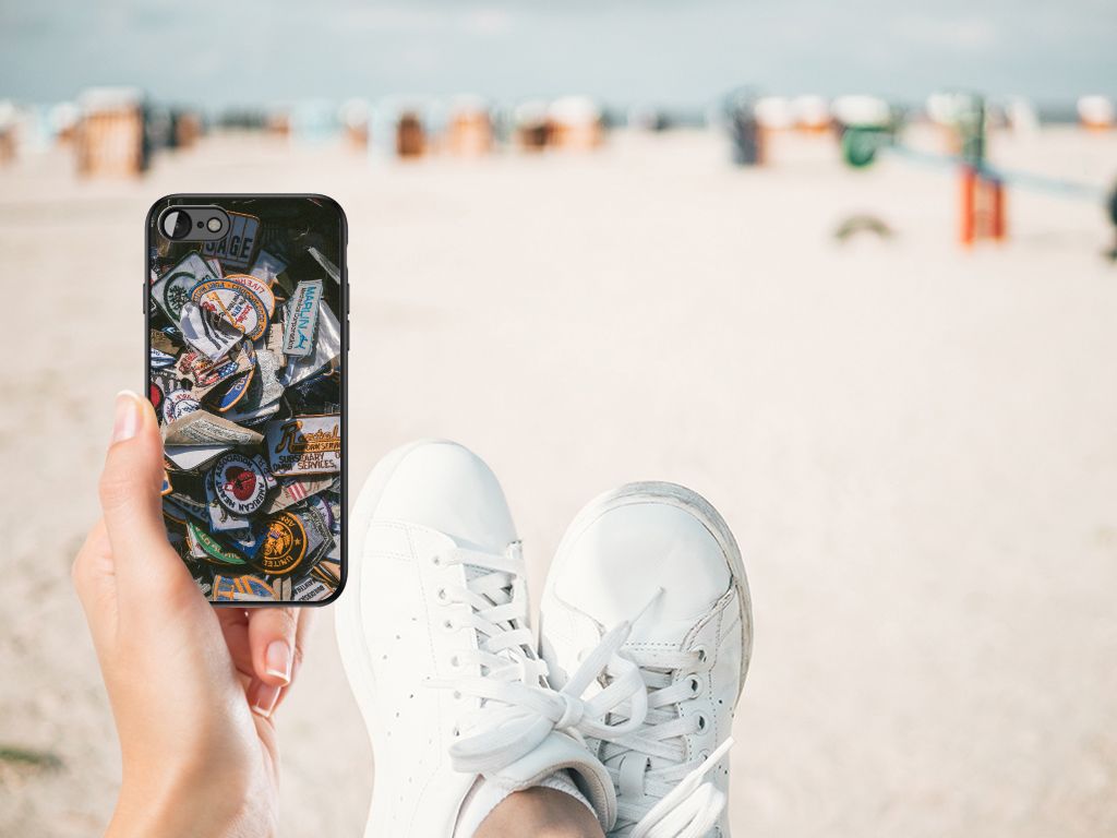 iPhone SE 2022 | SE 2020 | 7/8 Silicone Back Case Badges displayed on a beach with stylish sneakers.