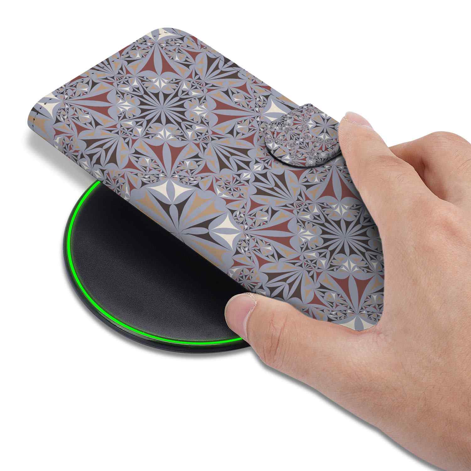 iPhone 16e Bookcase Flower Tiles design being placed on a wireless charger with a stylish pattern.
