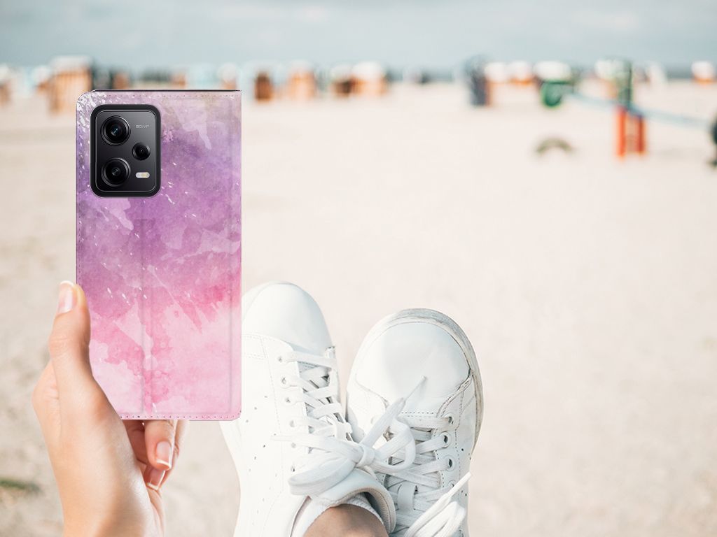 Bookcase Xiaomi Redmi Note 12 Pro | Poco X5 Pro Pink Purple Paint design op een strand, elegant en opvallend! 🎨