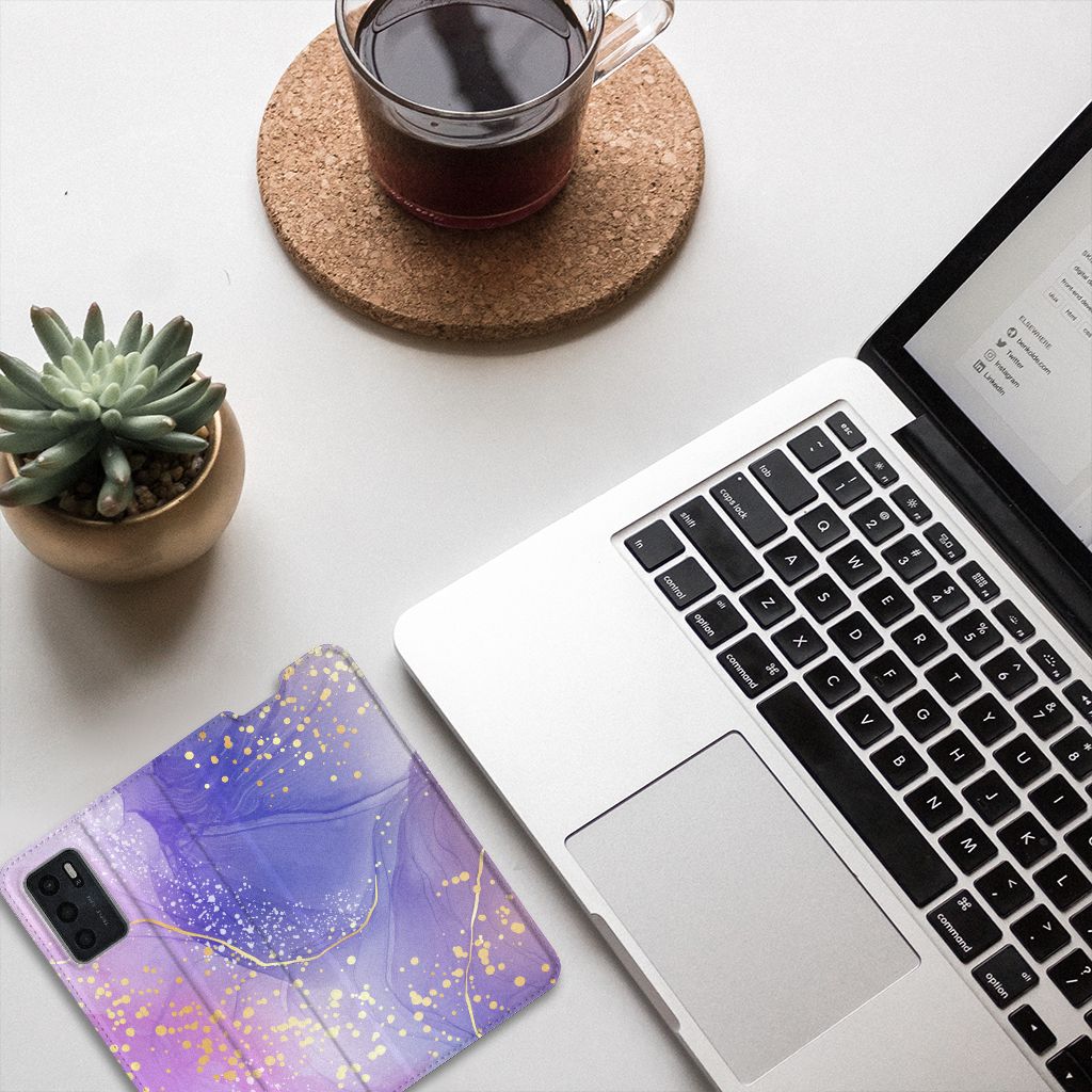 Bookcase voor OPPO A54s | A16 | A16s Watercolor Paars op een bureau met een laptop en kruidenplantje.
