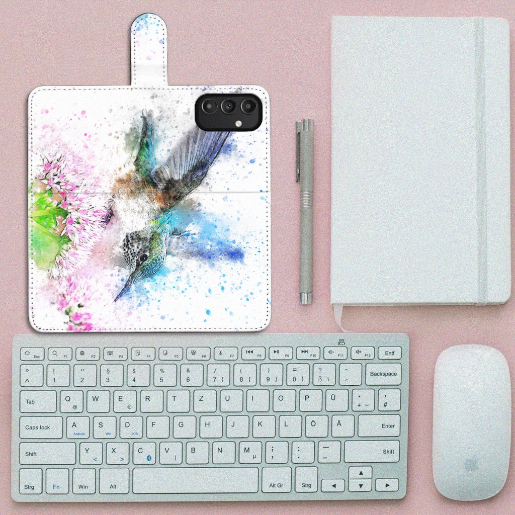 Hoesje Samsung Galaxy A14 4G Vogel met kleurrijke kolibrie en bloemontwerp op een bureau.