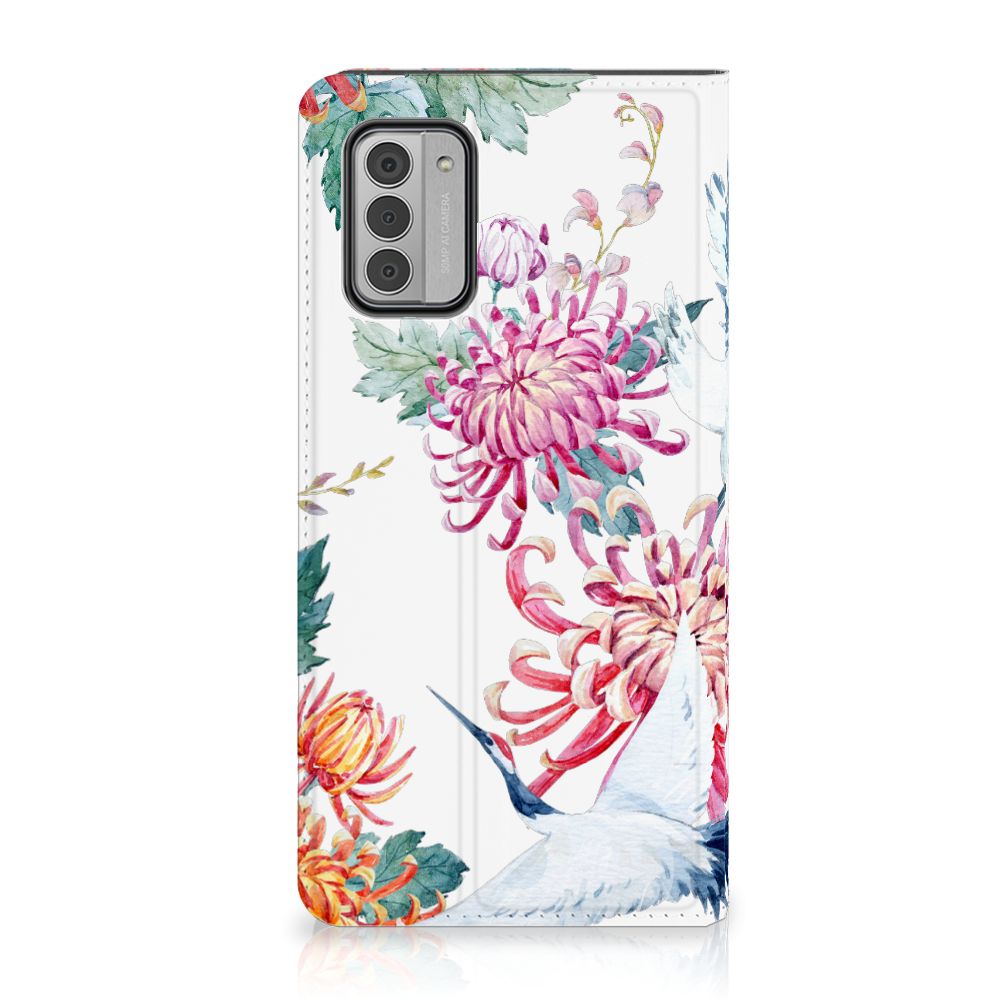Nokia G42 Hoesje maken Bird Flowers met kleurrijke bloemen en ooievaars voor optimale bescherming en uitstraling.