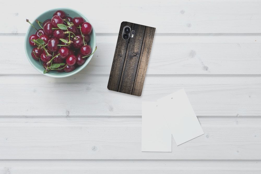 Nothing Phone (2) Book Wallet Case Steigerhout met keramische bruine achtergrond en een kom met kersen 🍒.
