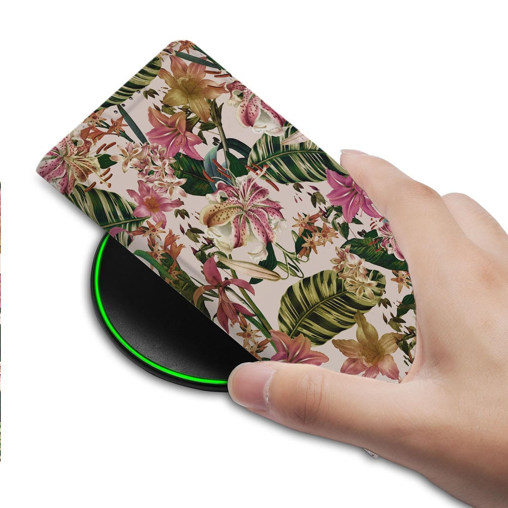 Samsung Galaxy S26 Ultra Book Case Flowers hand holding case wireless charger view.