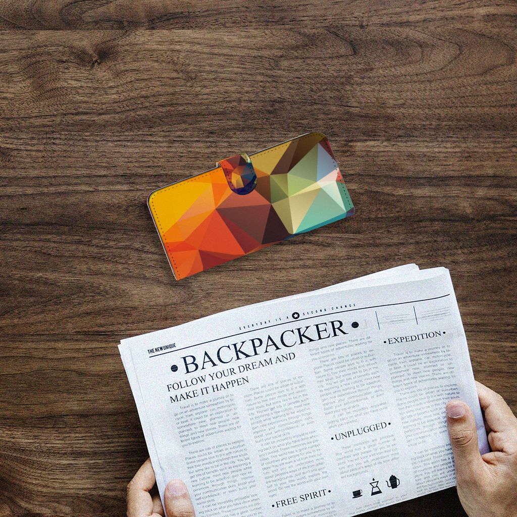 Samsung Galaxy A14 4G Book Case Polygon Color on a wooden table with a newspaper.