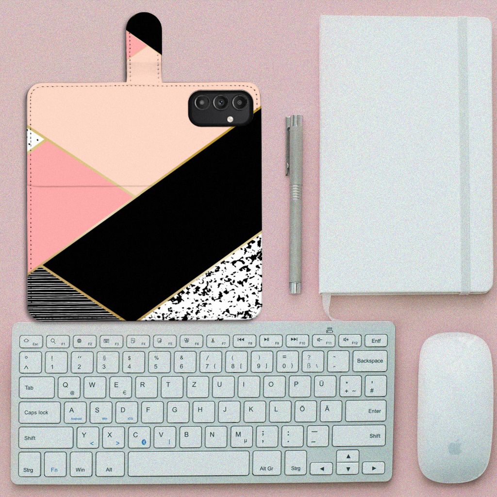 Samsung Galaxy A14 4G Book Case Zwart Roze Vormen op een bureau met toetsenbord en notitieboek.