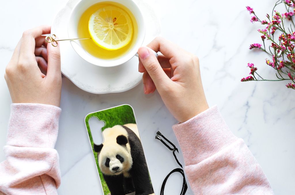 Samsung Galaxy A14 5G Case Anti-shock Panda displayed next to a cup of tea and lemon.