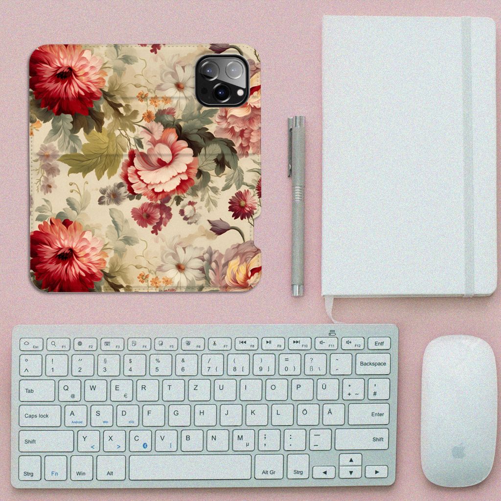 Smart Cover voor iPhone 14 Pro Max Bloemen met kleurrijke bloemenprint op een bureau met toetsenbord en muis.