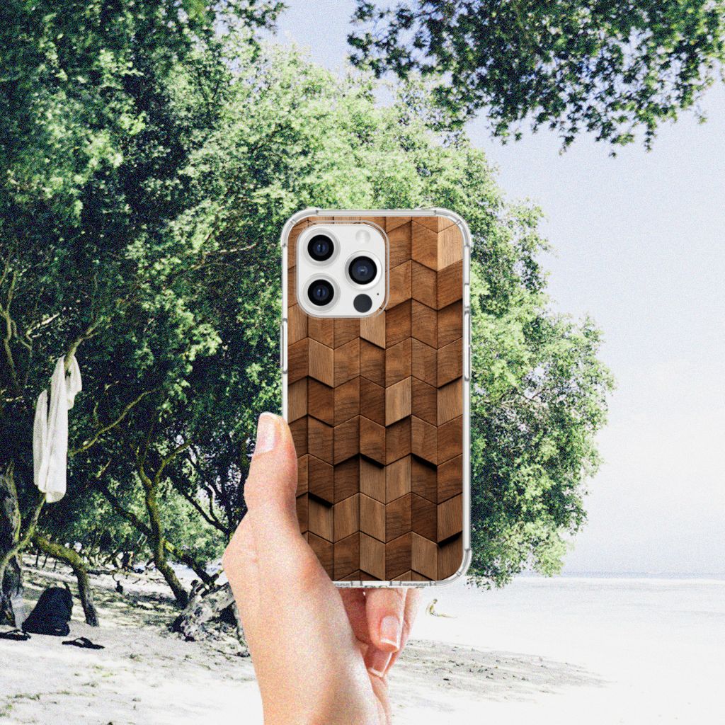Stevig Telefoonhoesje voor iPhone 13 Pro Max Wooden Cubes met een uniek houtprint design in hand op strand.