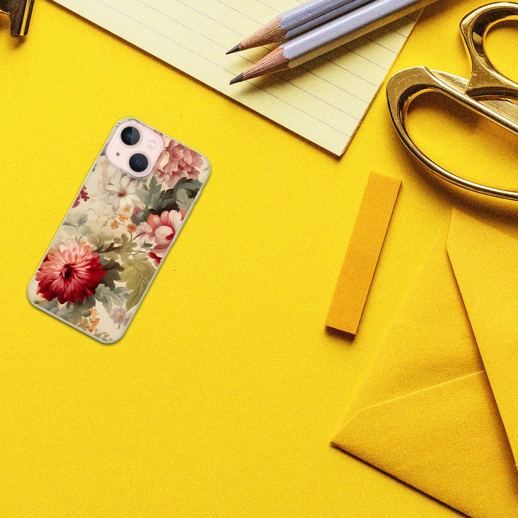 TPU Case voor iPhone 13 mini Bloemen ligt op een gele ondergrond tussen kantoorbenodigdheden.