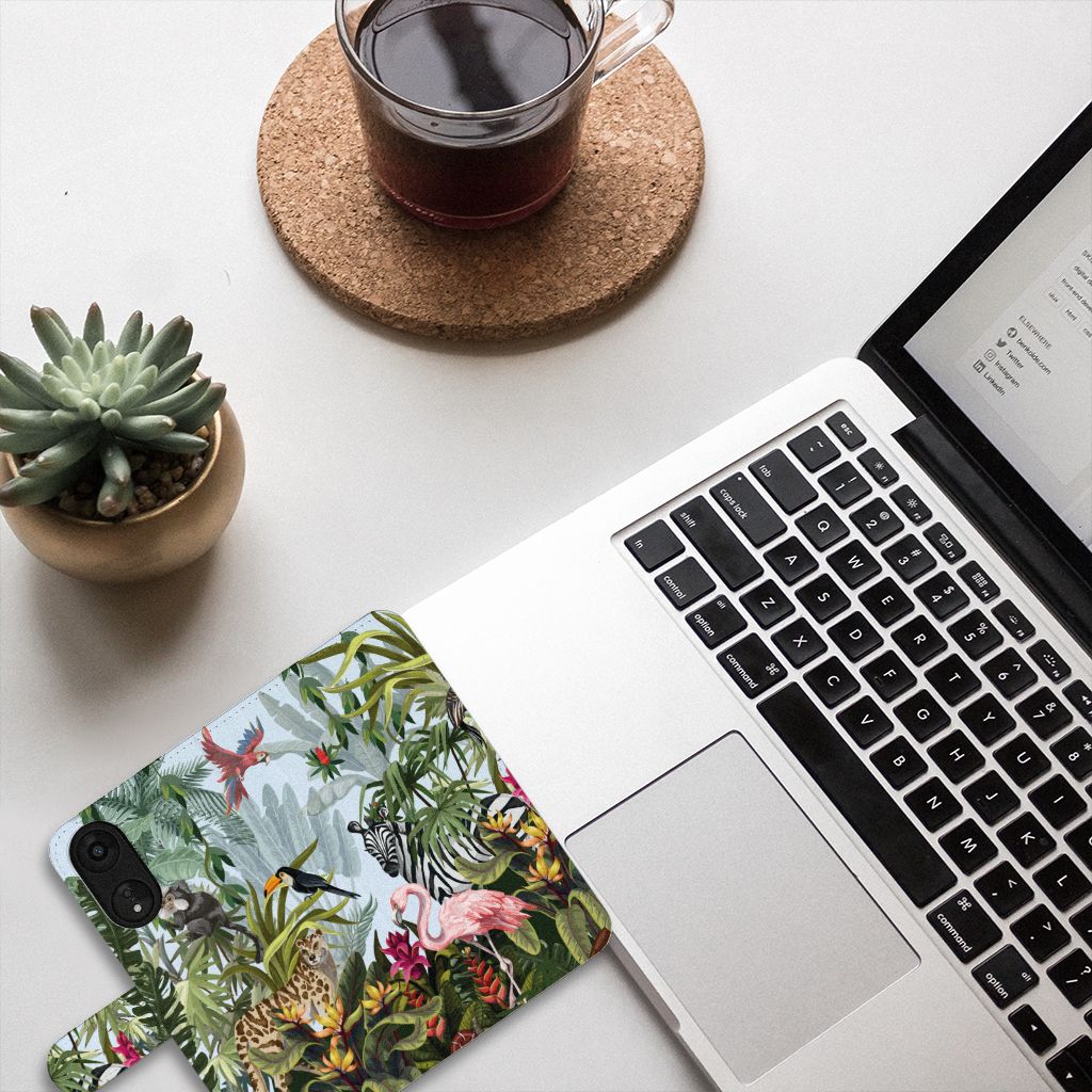 Telefoonhoesje met Pasjes voor OPPO A78 5G | A58 5G Jungle met tropische dieren design naast laptop en plant.