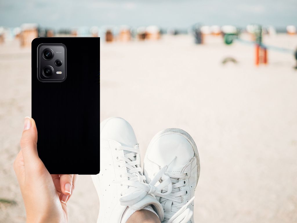 Xiaomi Redmi Note 12 Pro | Poco X5 Pro Hoesje maken Papegaai design zwart hand smartphone strand