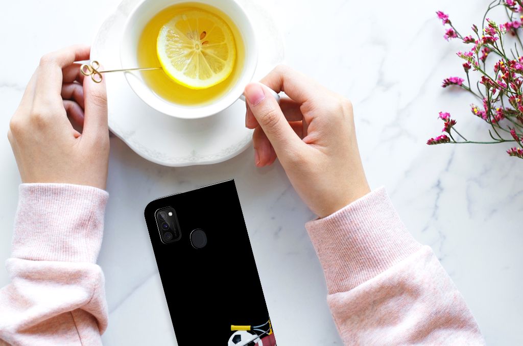 Samsung Galaxy M30s | M21 Hippe Standcase Sports design in use with tea and lemon, showcasing its sporty prints.