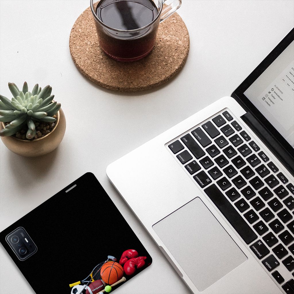 Xiaomi 11T | Xiaomi 11T Pro Hippe Standcase Sports with sports equipment on a desk next to a laptop and plant.