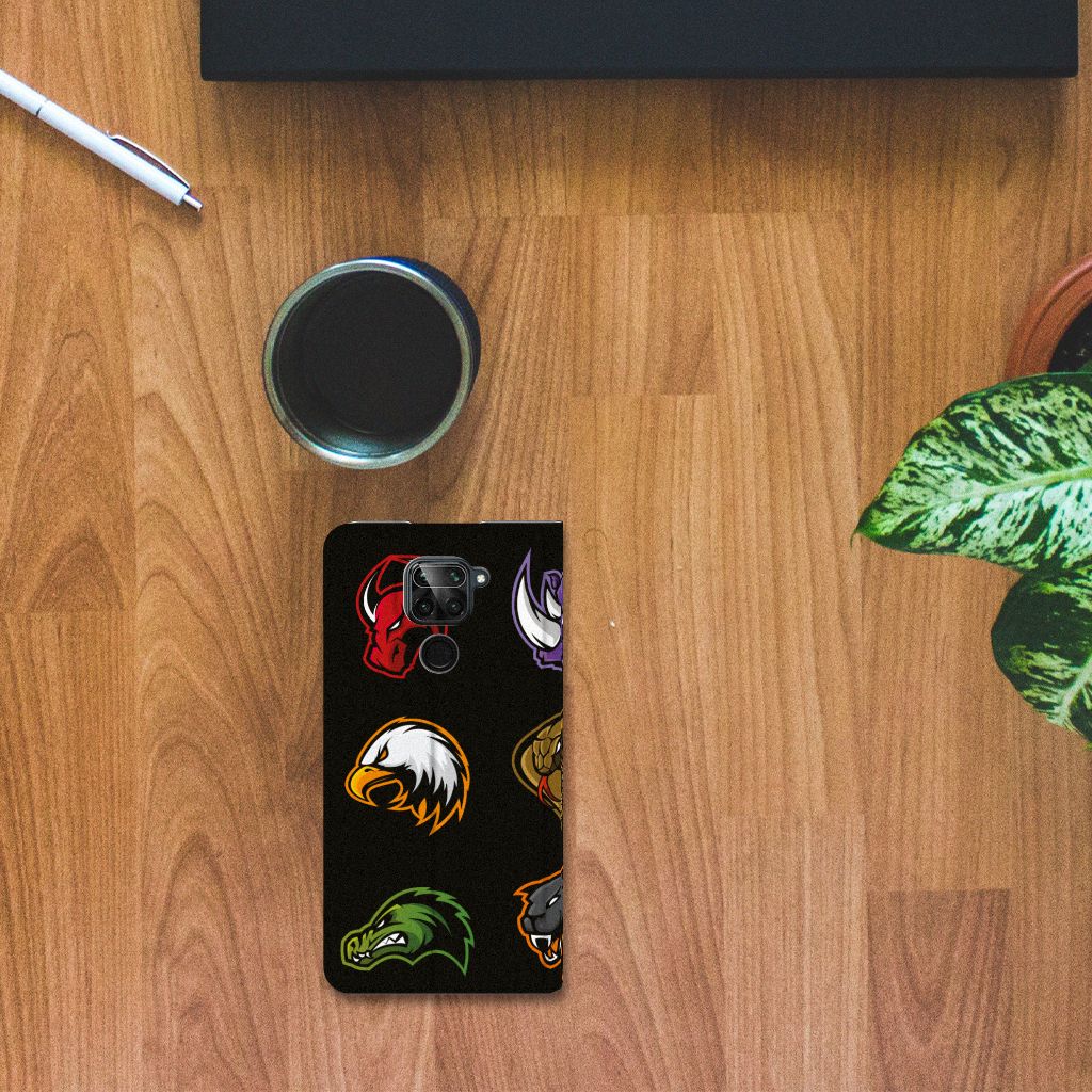 Xiaomi Redmi Note 9 Magnet Case Cartoon with colorful cartoon designs on a wooden table.
