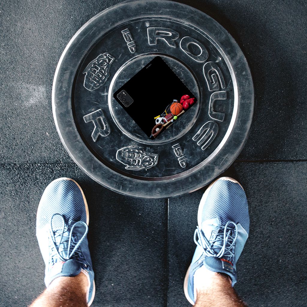 OPPO Reno6 5G Hippe Standcase Sports in a creative gym setting with a weight plate and sports gear.