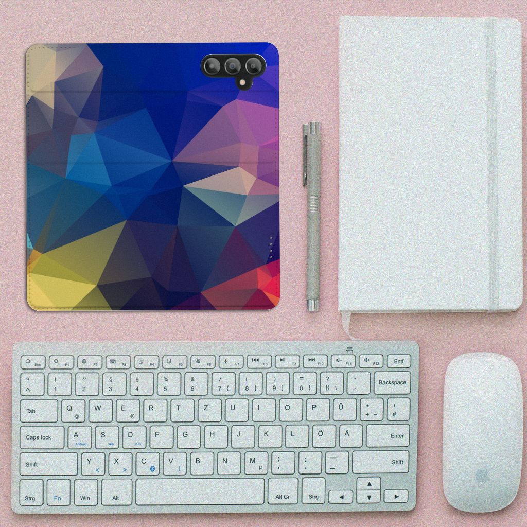 Samsung Galaxy A14 4G Stand Case Polygon Dark design on a desk with a keyboard and notebook.