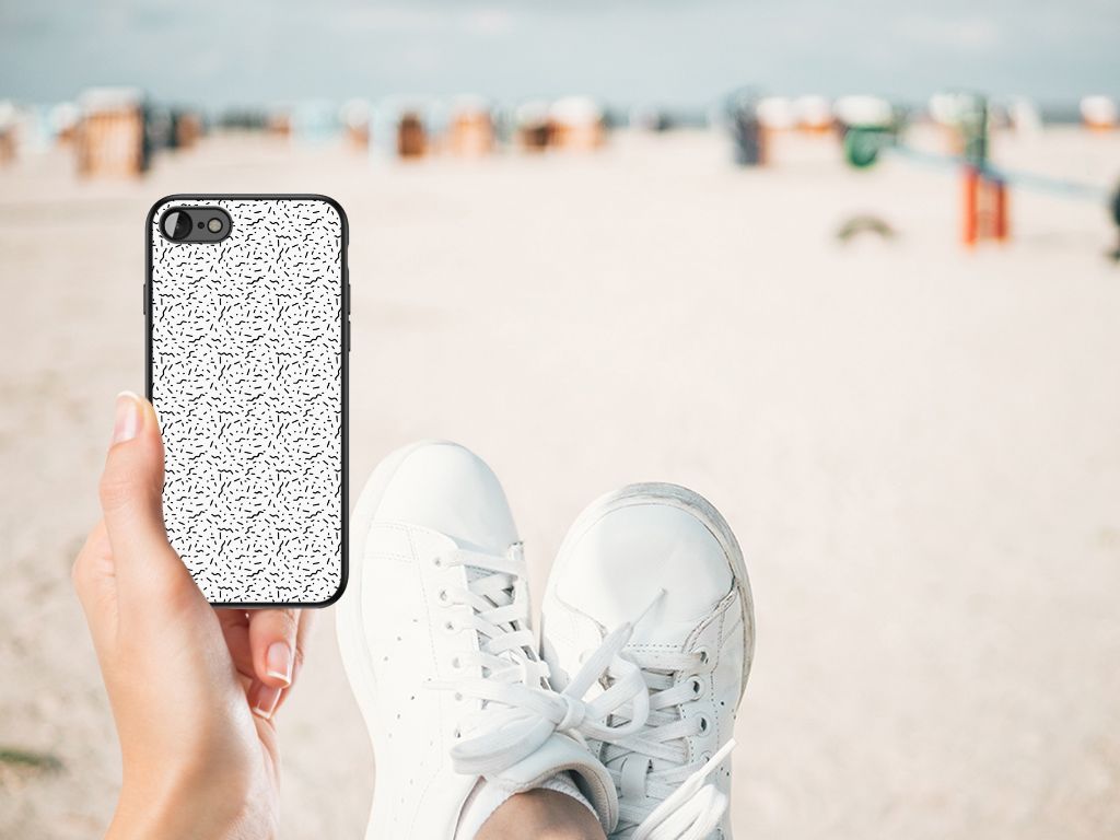 iPhone SE 2022 | SE 2020 | 7/8 Back Case Stripes Dots displayed on a beach with sneakers.