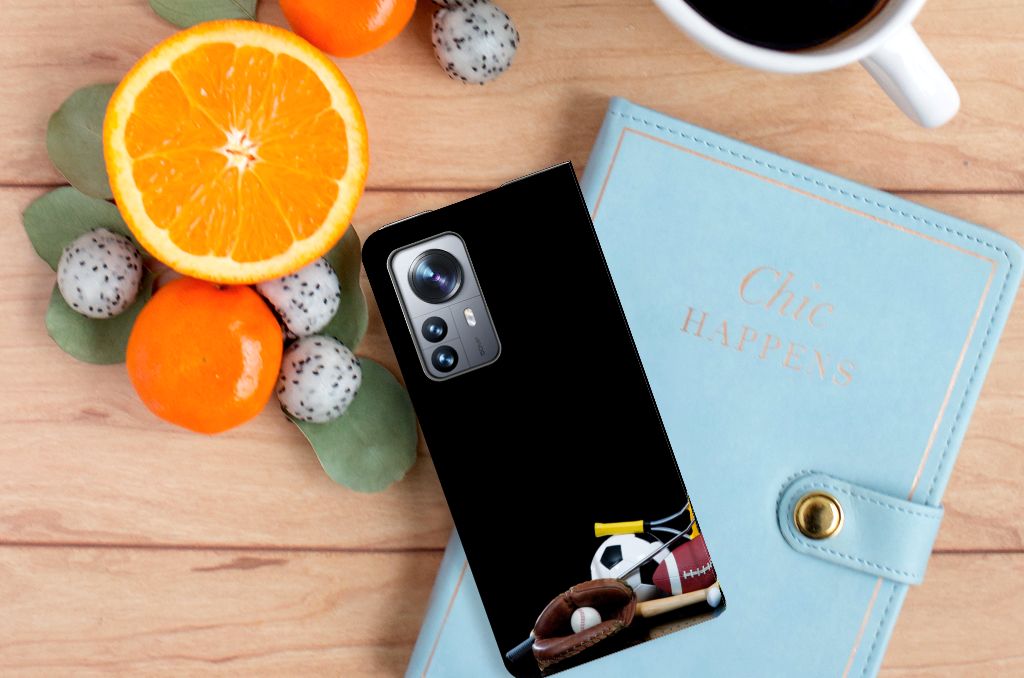 Xiaomi 12 Pro Hippe Standcase Sports design with sports equipment on table, next to fruits and a notebook.