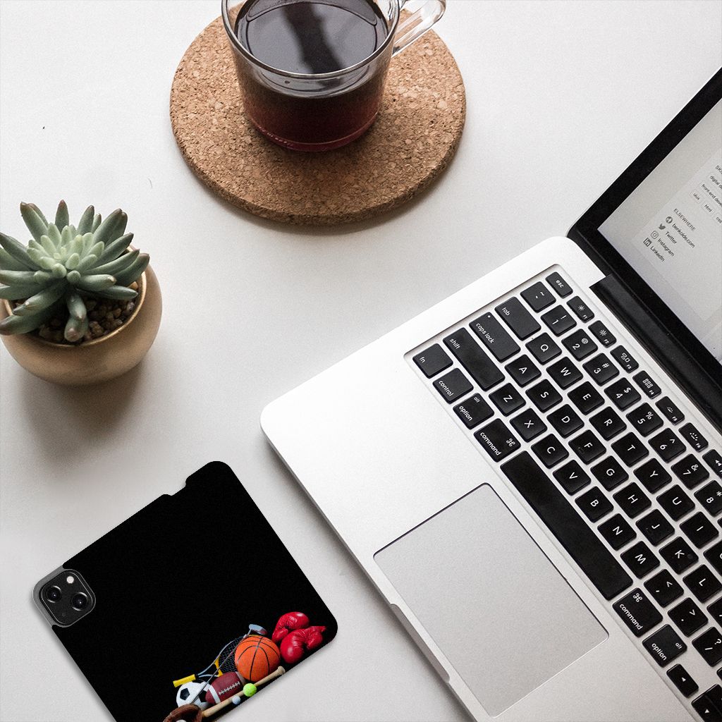 iPhone 13 Mini Hippe Standcase Sports design with sports equipment on a desk near a laptop and coffee
