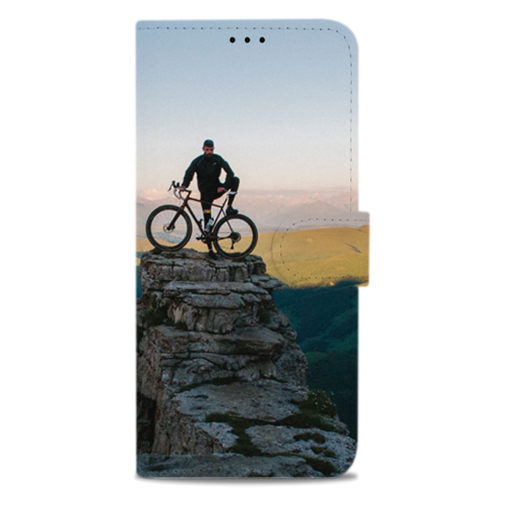 Dichte Galaxy A51 bookcase met op de voorkant een mountainbiker en zijn fiets boven een dal