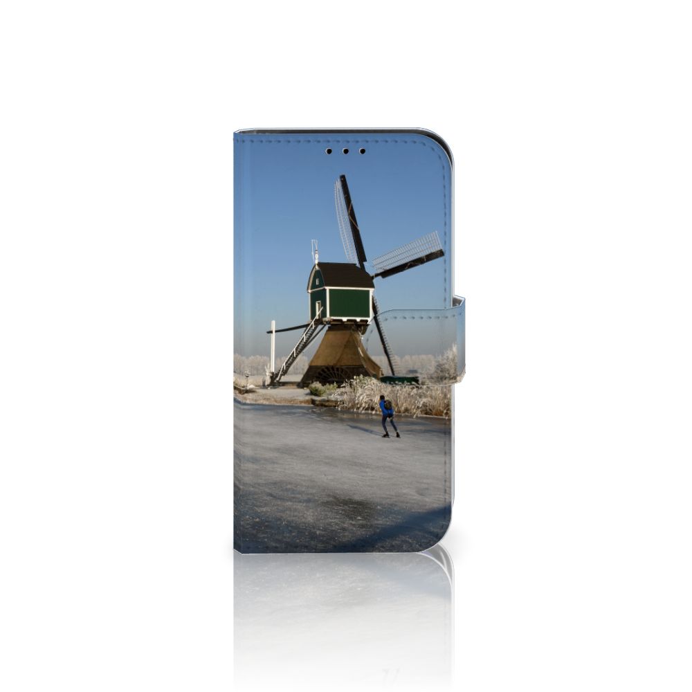 iPhone 13 Mini Flip Cover Schaatsers met een schaatser bij een traditionele Nederlandse molen 🏔️.