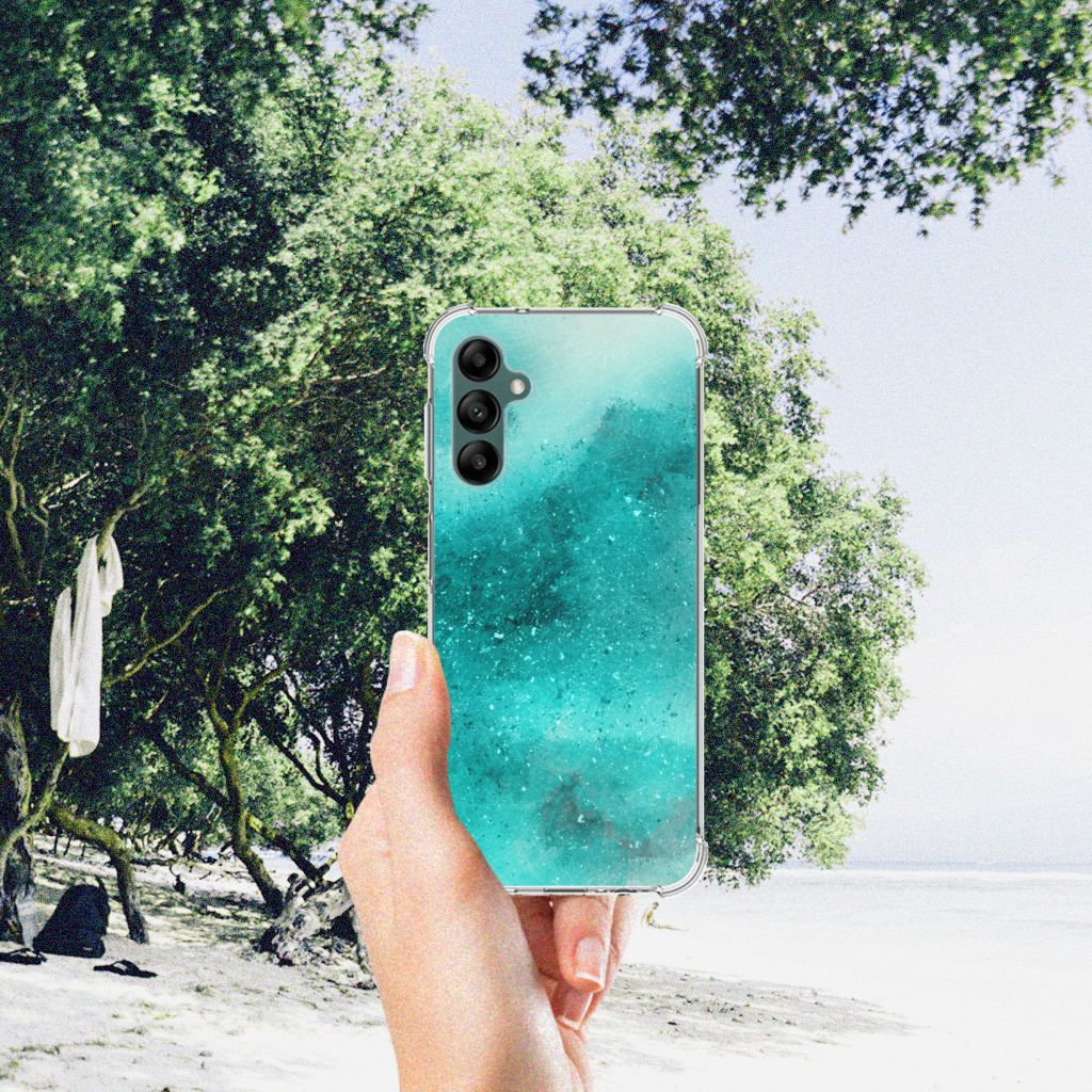 Back Cover Samsung Galaxy A14 5G/4G Painting Blue held against a beach background with trees.