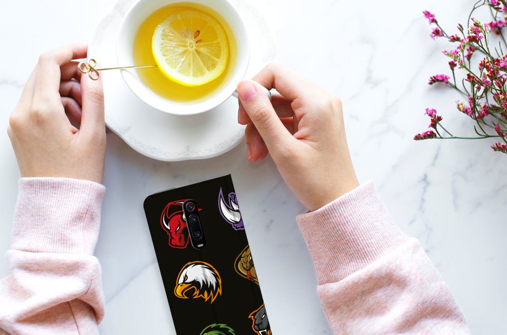 Xiaomi Redmi K20 Pro Magnet Case Cartoon with colorful designs and a cup of tea on a marble table.