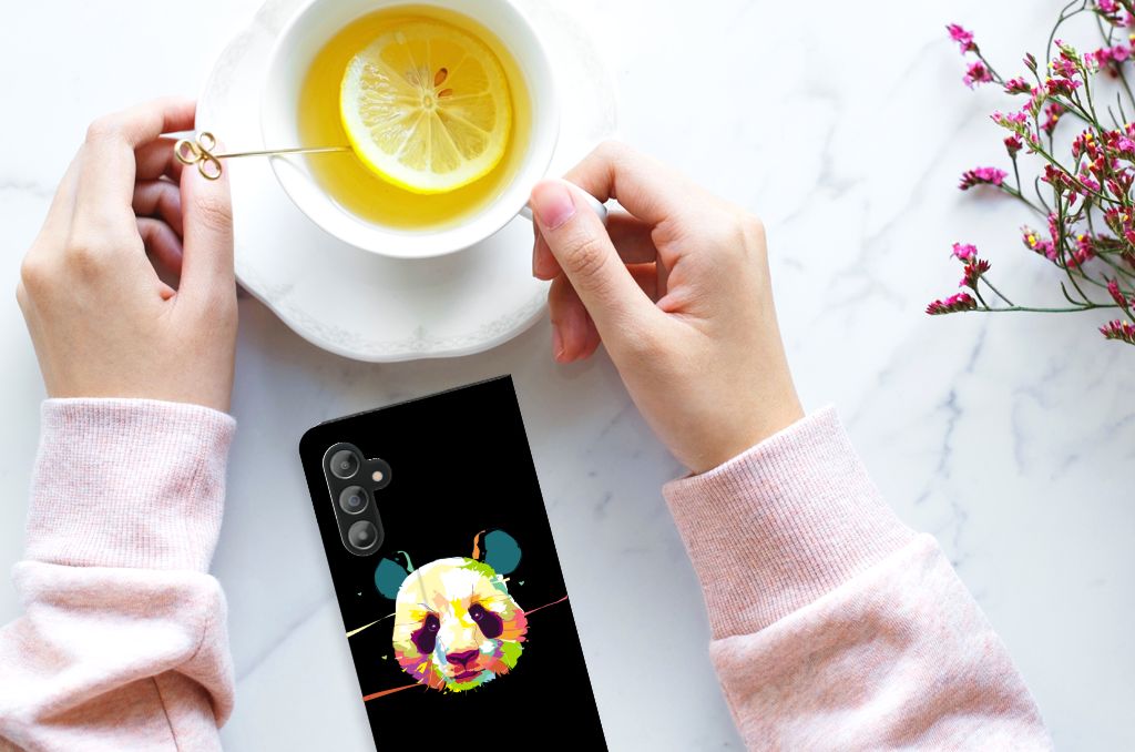 Samsung Galaxy A14 4G Magnet Case Panda Color design displayed beside a cup of tea with lemon.