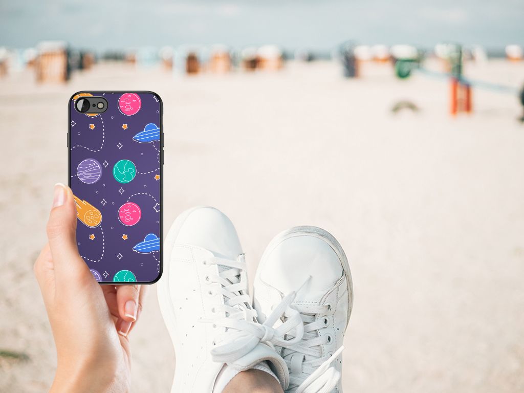 iPhone SE 2022 | SE 2020 | 7/8 GSM Cover Space held at the beach with a colorful planet design on a sunny day.