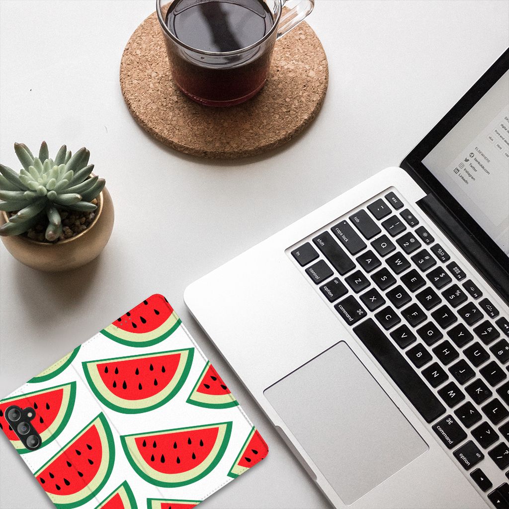 Samsung Galaxy A14 5G Flip Style Cover Watermelons design on a desk with laptop and coffee.