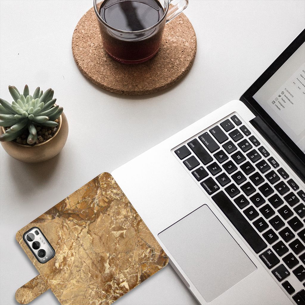 OPPO Find X3 Neo 5G Bookcase Marmer Creme op een bureau met een laptop en een plant.