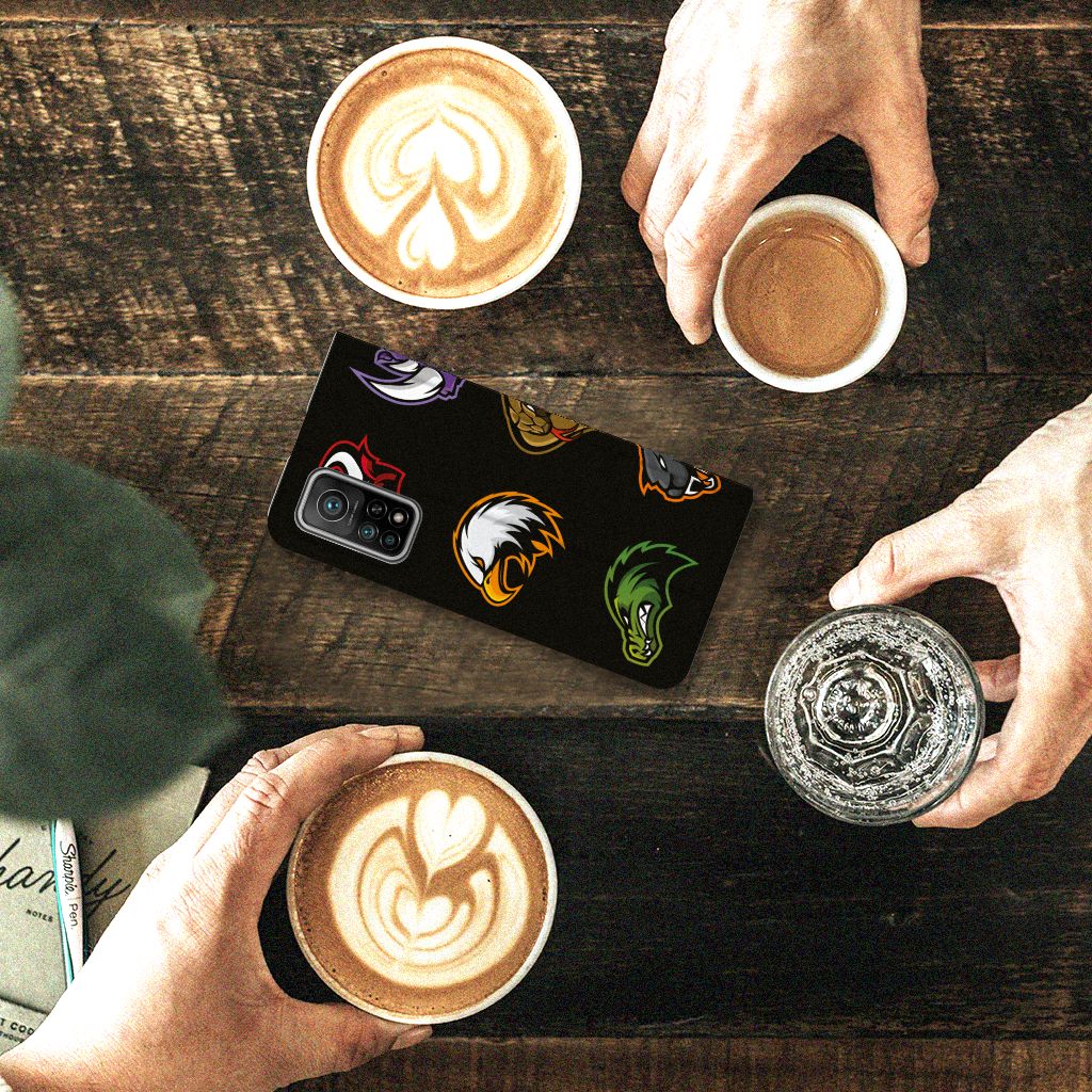 Xiaomi Mi 10T | 10T Pro Magnet Case Cartoon with colorful designs on a wooden table with coffee cups.