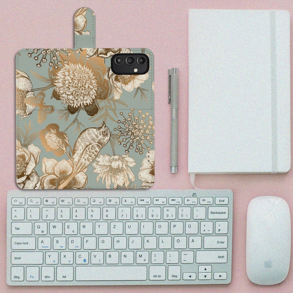 Hoesje voor Samsung Galaxy A14 5G Vintage Bird Flowers op een bureau met accessoires.