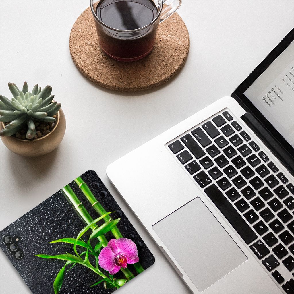 Samsung Galaxy A14 5G Smart Cover Orchidee on a workspace with laptop and coffee.
