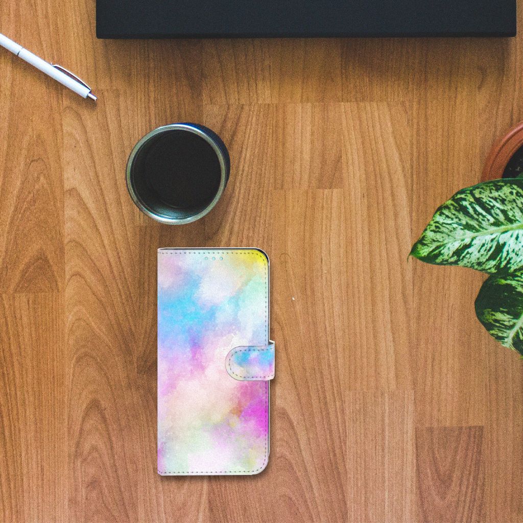Hoesje OPPO A76 | A96 Watercolor Light op een houten tafel met een kop koffie en planten.