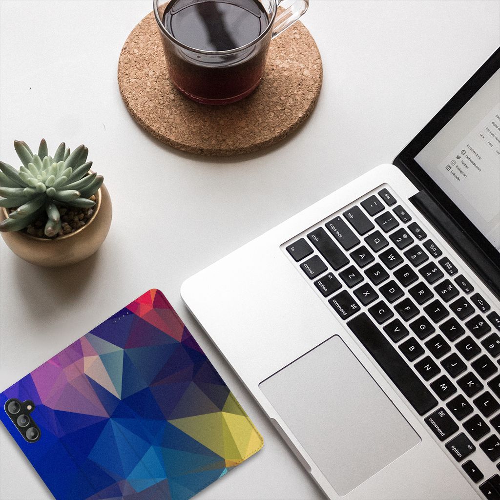 Samsung Galaxy A14 5G Stand Case Polygon Dark on a desk with laptop and cup of tea.