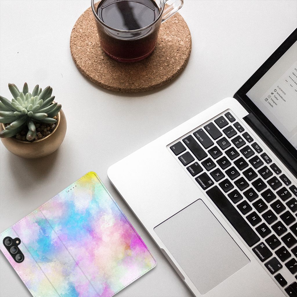 Bookcase Samsung Galaxy A14 5G Watercolor Light design on a desk next to a laptop and coffee.