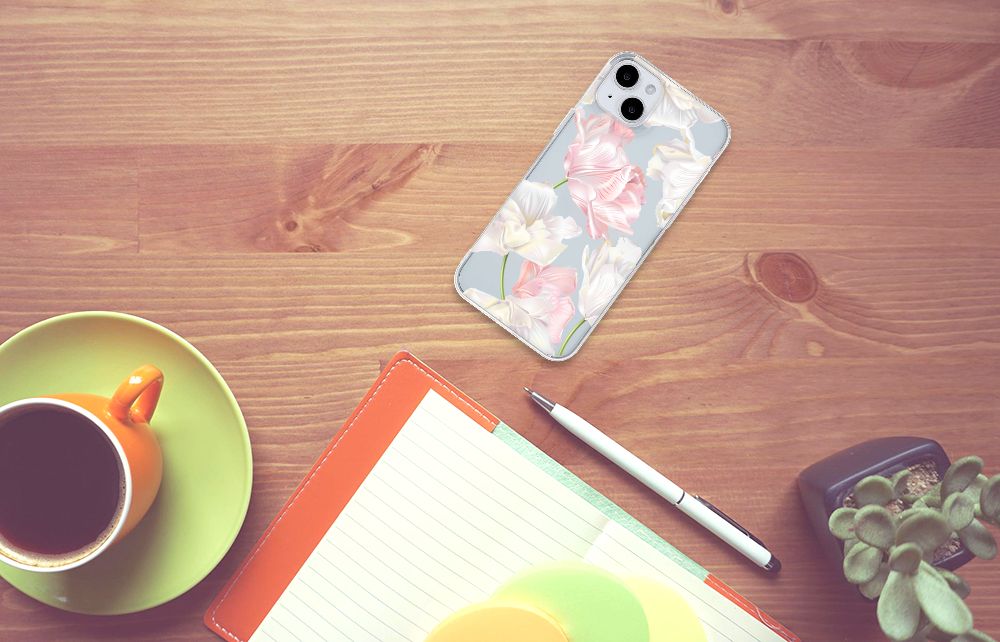 iPhone 15 Plus TPU Case Lovely Flowers on a wooden table with a cup, notepad, and pen.